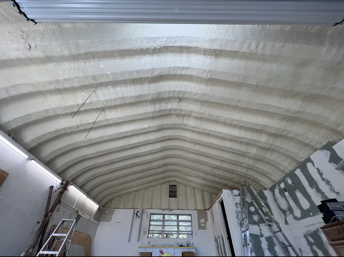 Spray polyurethane foam applied to the underside of a metal roof deck in West Pennsboro